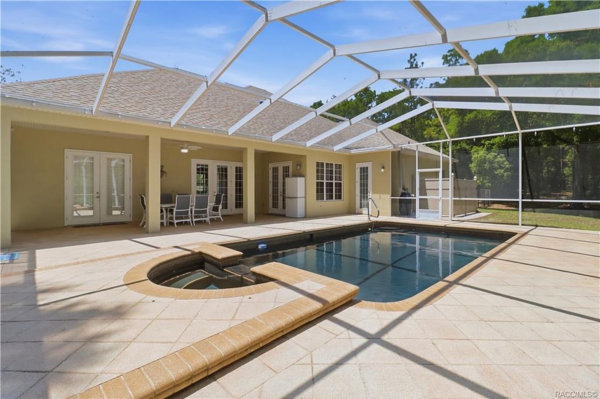 Screened lanai and pool at a Citrus County rental home managed by Roam Management