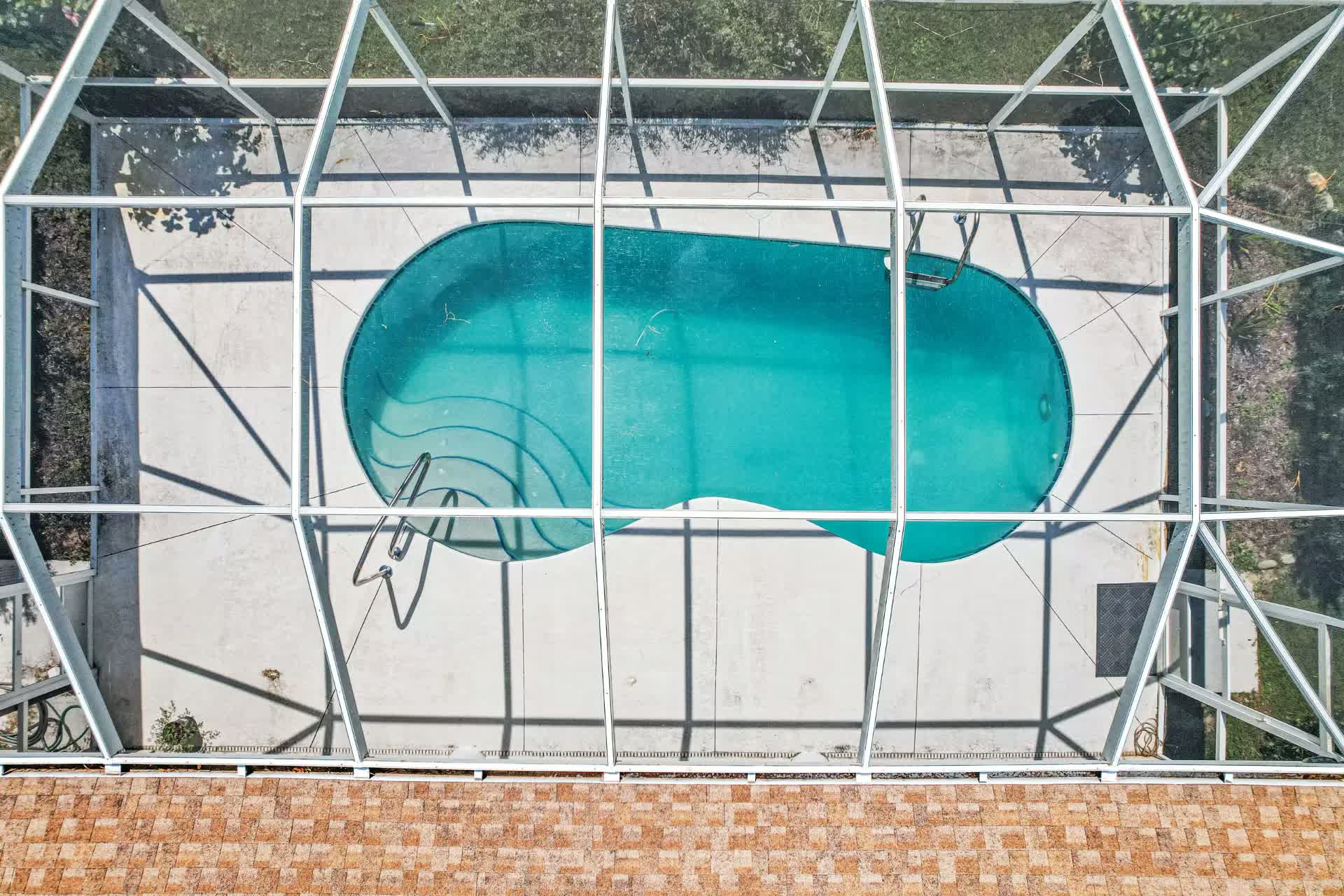 Screen enclosed pool at the Woodside vacation home managed by Roam Management